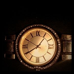 Golden watch with diamonds
